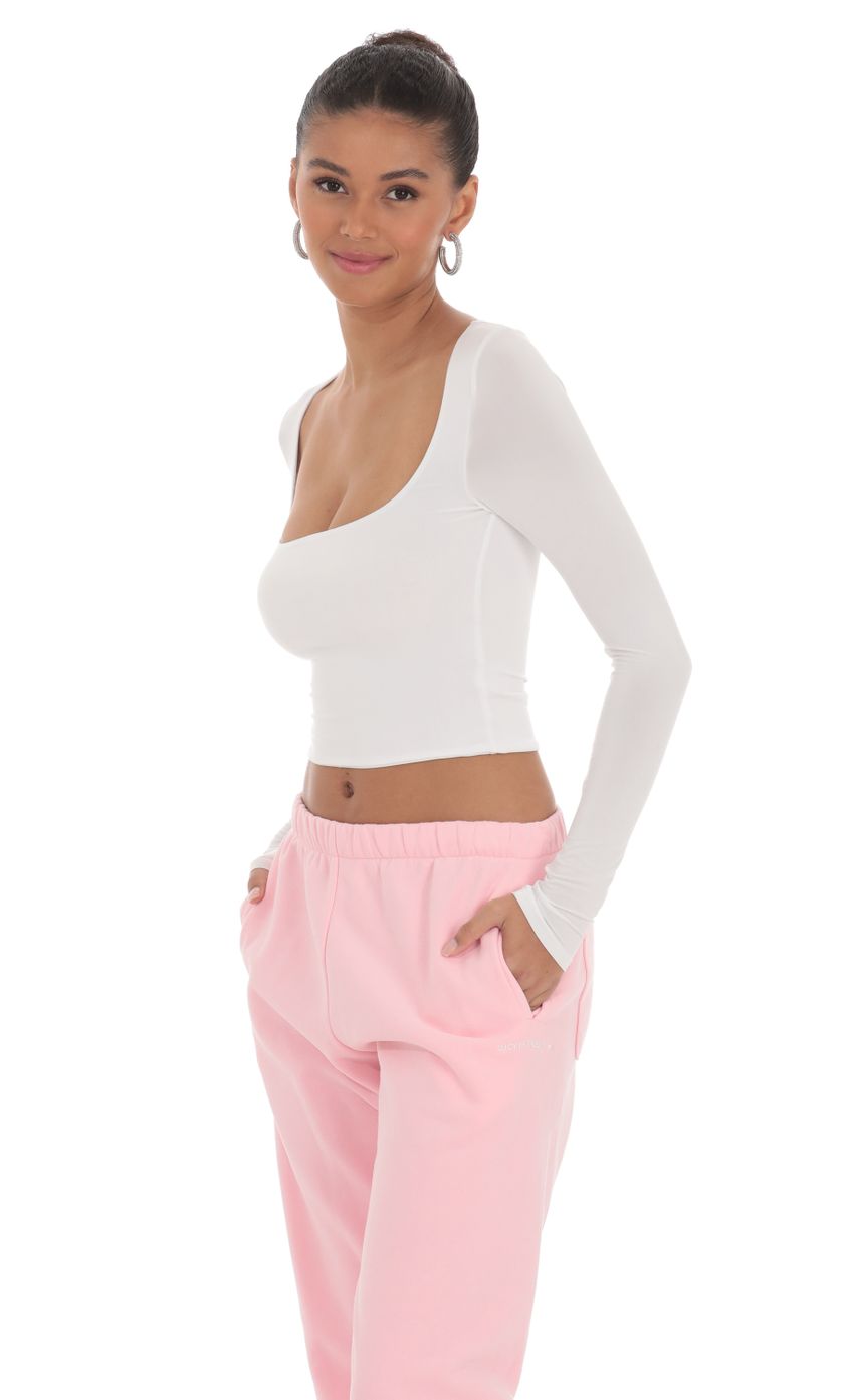 Picture Scoop Neck Long Sleeve Top in White. Source: https://media-img.lucyinthesky.com/data/Mar24/850xAUTO/b4a90fa0-45fd-4eaf-b7ad-735b3959a35d.jpg