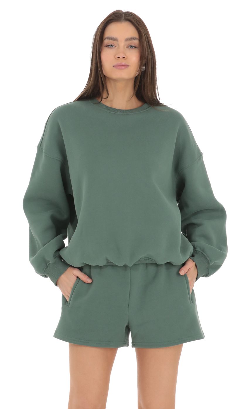 Picture Fleece Jumper in Hunter. Source: https://media-img.lucyinthesky.com/data/Mar24/850xAUTO/bb3a0559-109e-49a6-a489-80b86c8085f0.jpg
