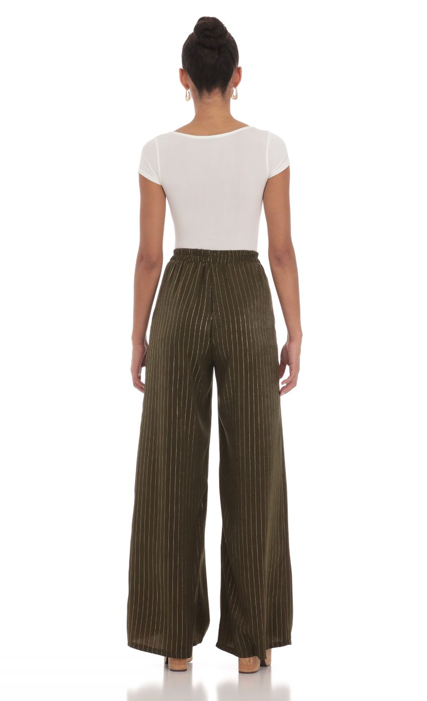 Picture Wide Shimmer Striped Pants in Dark Olive. Source: https://media-img.lucyinthesky.com/data/Mar24/850xAUTO/bf125699-3663-4b63-8301-2e495085f38c.jpg