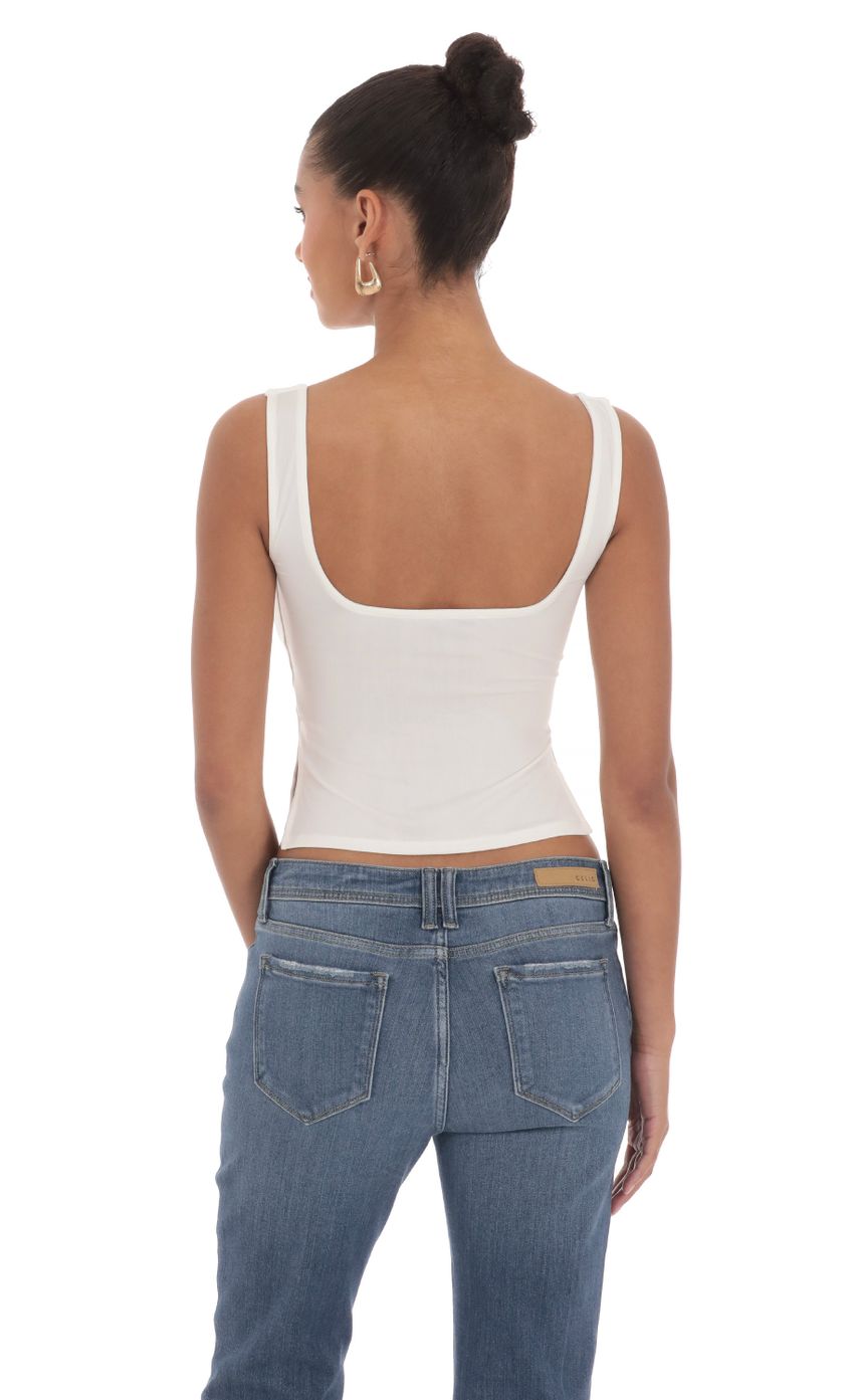 Picture Side Slit Top in White. Source: https://media-img.lucyinthesky.com/data/Mar24/850xAUTO/bf64b2a0-fc98-4ad7-a3ab-a475bd4219d7.jpg