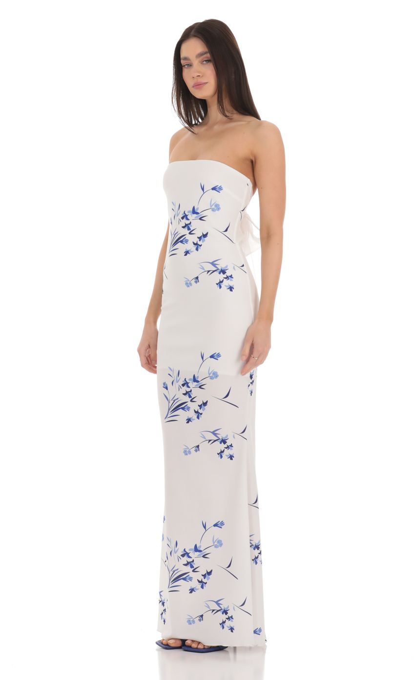 Picture Floral Back Bow Strapless Maxi Dress in White. Source: https://media-img.lucyinthesky.com/data/Mar24/850xAUTO/c46c16e9-056f-420f-8547-690d7caae6e6.jpg
