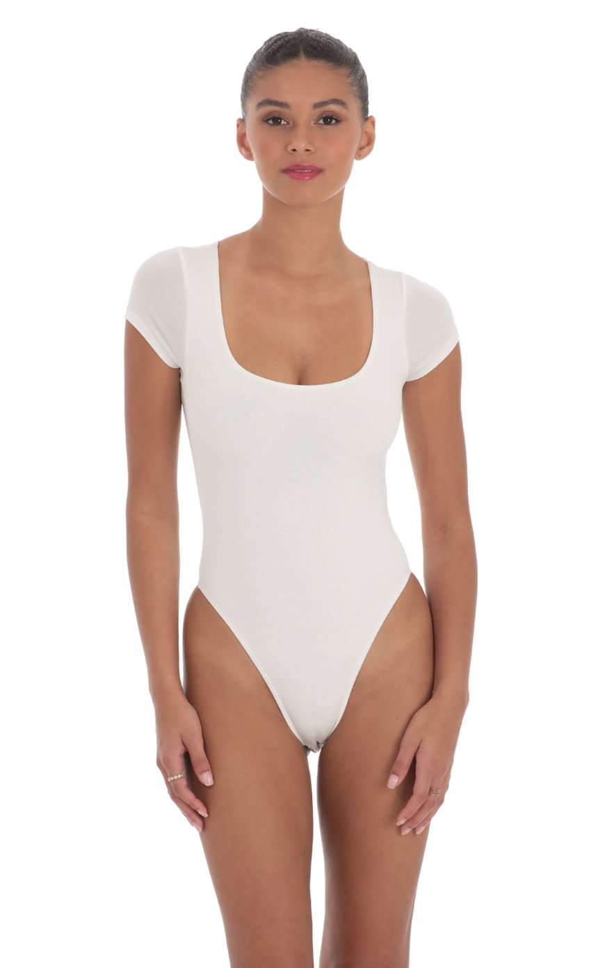 Picture Short Sleeve High Thigh Bodysuit in White. Source: https://media-img.lucyinthesky.com/data/Mar24/850xAUTO/c635ceb5-3de8-4cf9-a22a-71f6f8cd5521.jpg