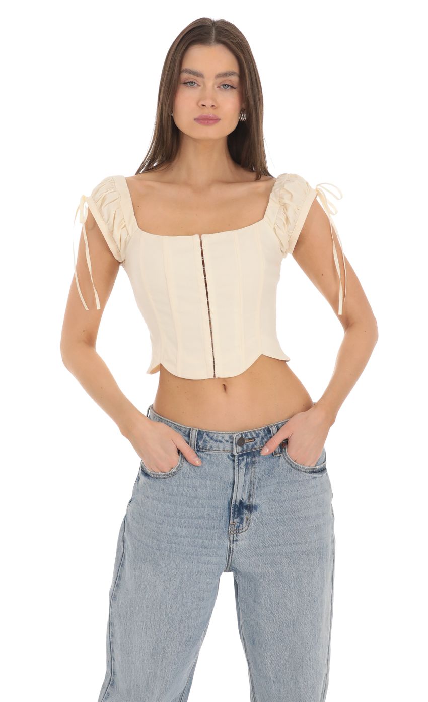 Picture Puff Sleeve Corset Top in Cream. Source: https://media-img.lucyinthesky.com/data/Mar24/850xAUTO/c956c589-639e-4a2e-bc9f-de6af29d97f9.jpg