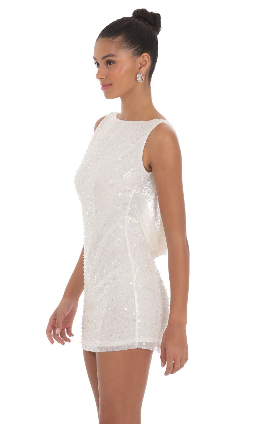Picture Sequin Draped Open Back Dress in White. Source: https://media-img.lucyinthesky.com/data/Mar24/850xAUTO/e1a4208a-20e6-48ff-9001-27889abecb78.jpg