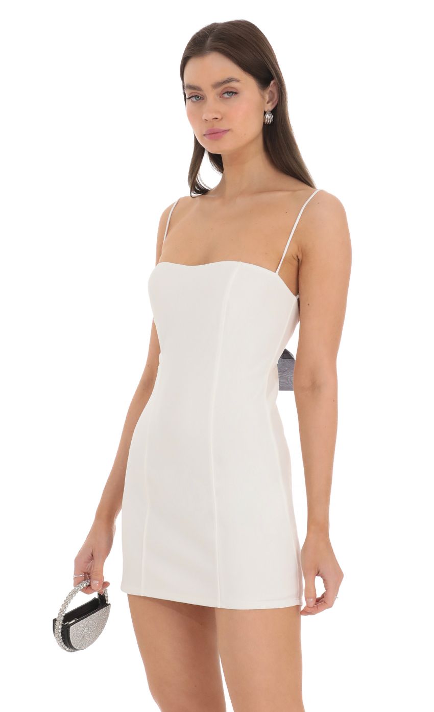 Picture Black Back Bow Bodycon Dress in White. Source: https://media-img.lucyinthesky.com/data/Mar24/850xAUTO/e2fe4d73-4fe7-445b-9737-e11010a8ac6d.jpg