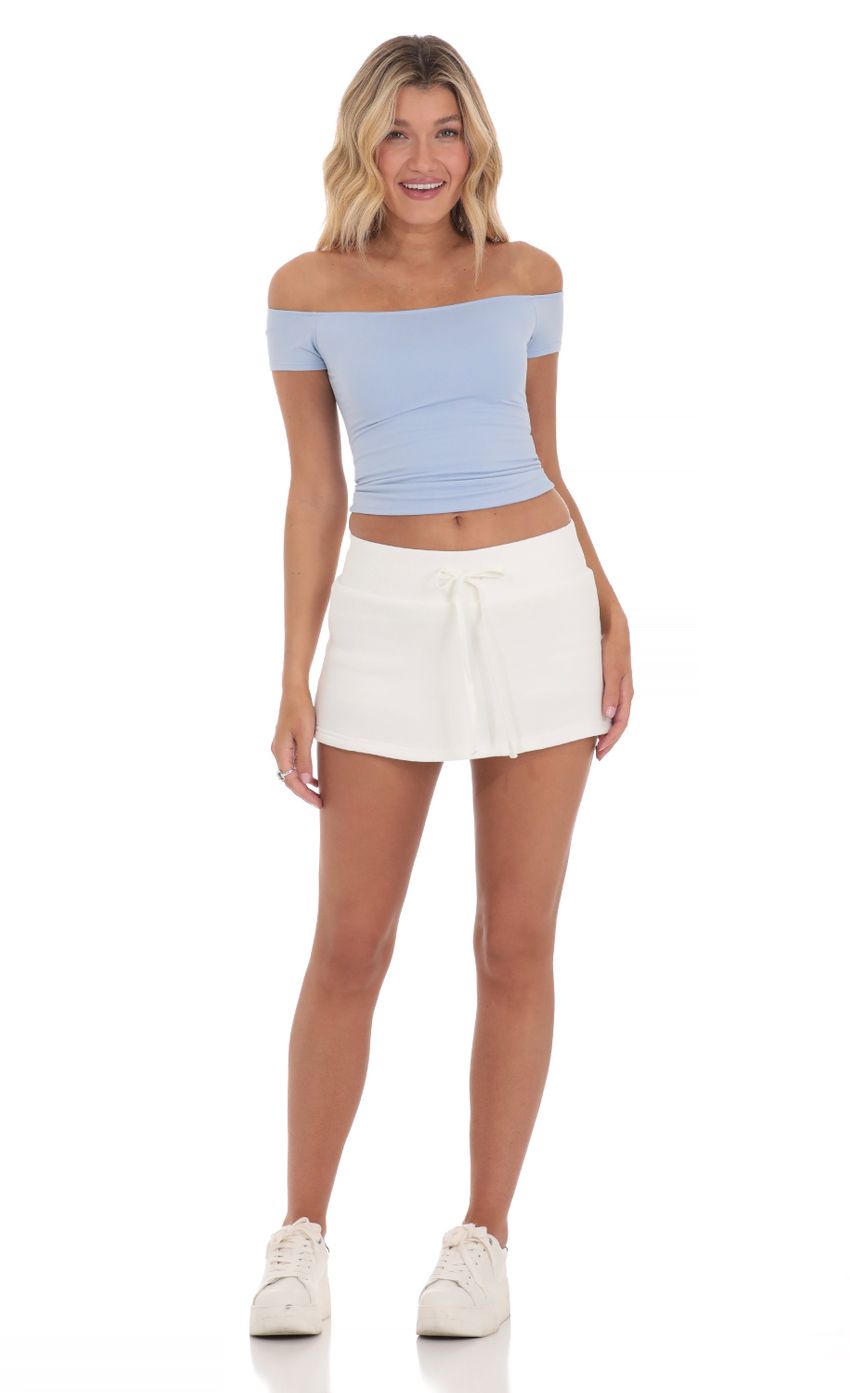 Picture Off Shoulder Top in Blue. Source: https://media-img.lucyinthesky.com/data/Mar24/850xAUTO/ec1515a4-3c5a-429f-bbe6-141f65a7b9e3.jpg