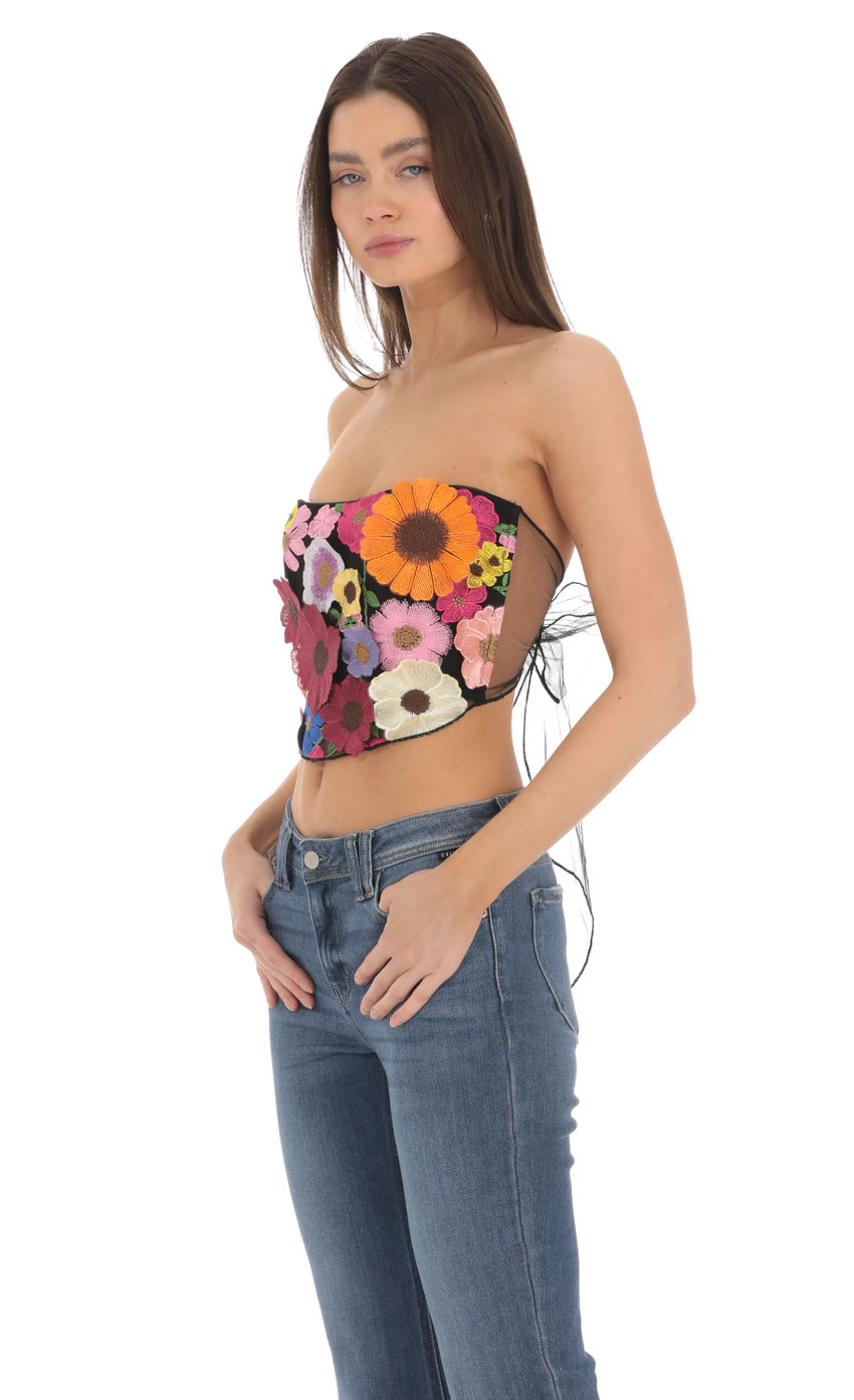 Picture 3-D Flower Strapless Top in Black. Source: https://media-img.lucyinthesky.com/data/Mar24/850xAUTO/ede2d1e0-e8f6-4e0a-ae1c-d85e91454f2f.jpg