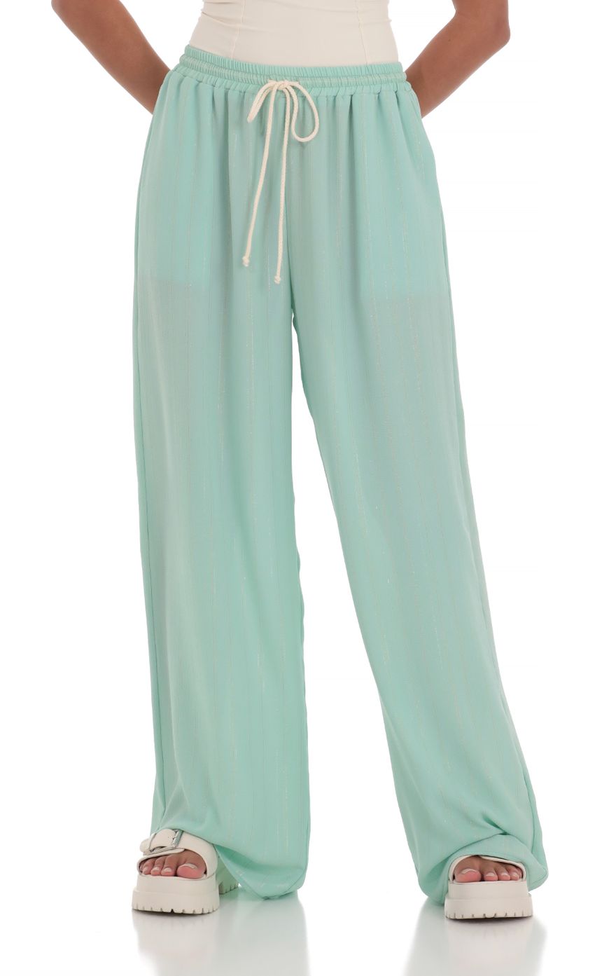 Picture Wide Leg Shimmer Pants in Mint Green. Source: https://media-img.lucyinthesky.com/data/Mar24/850xAUTO/f3b4158e-8fbd-4a0e-9de7-af4e0ded9a88.jpg