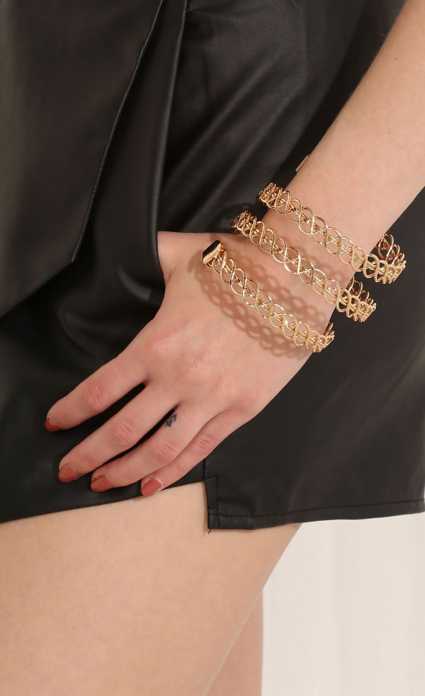 Picture Wound And Coiled Gold Bracelet. Source: https://media-img.lucyinthesky.com/data/May15_2/850xAUTO/0Y5A3084.JPG