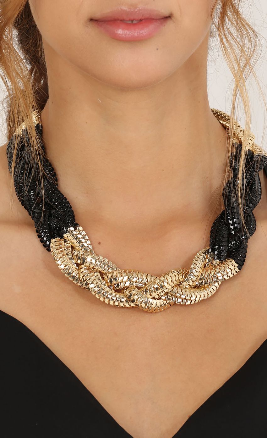 Picture Black And Gold Chunky Interwoven Necklace. Source: https://media-img.lucyinthesky.com/data/May15_2/850xAUTO/0Y5A5711.JPG