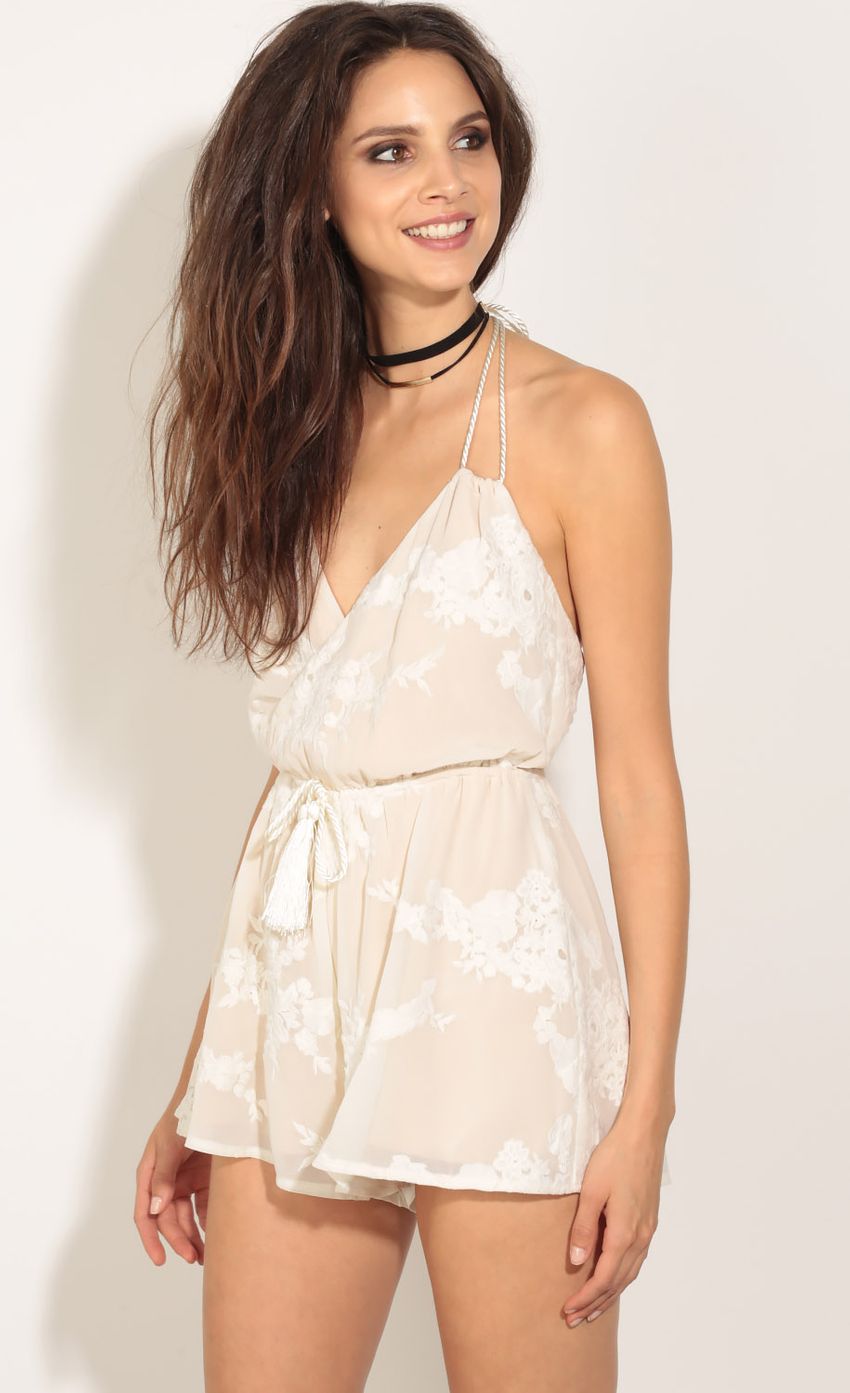 Picture Floral Tassel Wrap Romper In Champagne. Source: https://media-img.lucyinthesky.com/data/May16_1/850xAUTO/0Y5A4190.JPG