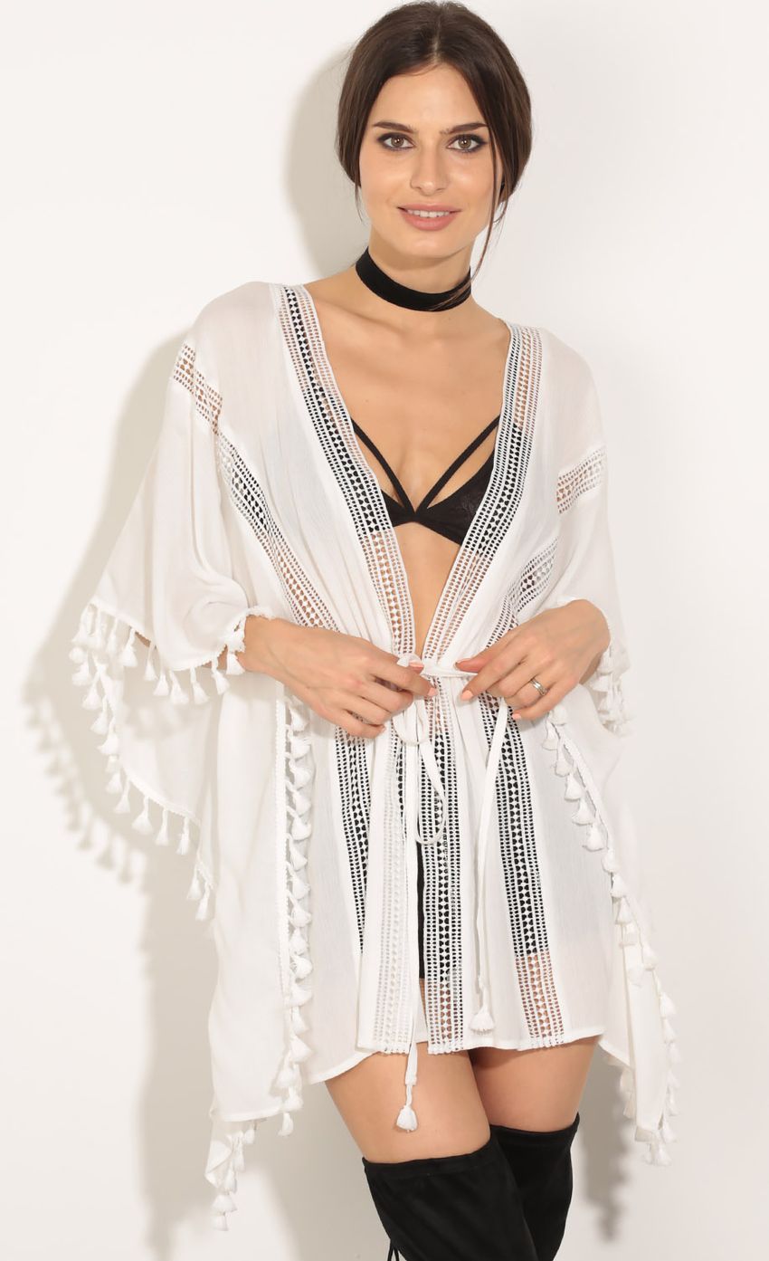 Picture Tassel Plunge Tunic In White. Source: https://media-img.lucyinthesky.com/data/May16_2/850xAUTO/0Y5A3971.JPG