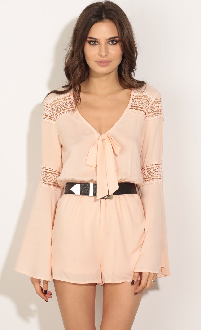 Picture Bell Sleeve Tie-Up Romper In Peach. Source: https://media-img.lucyinthesky.com/data/May16_2/850xAUTO/0Y5A6522.JPG