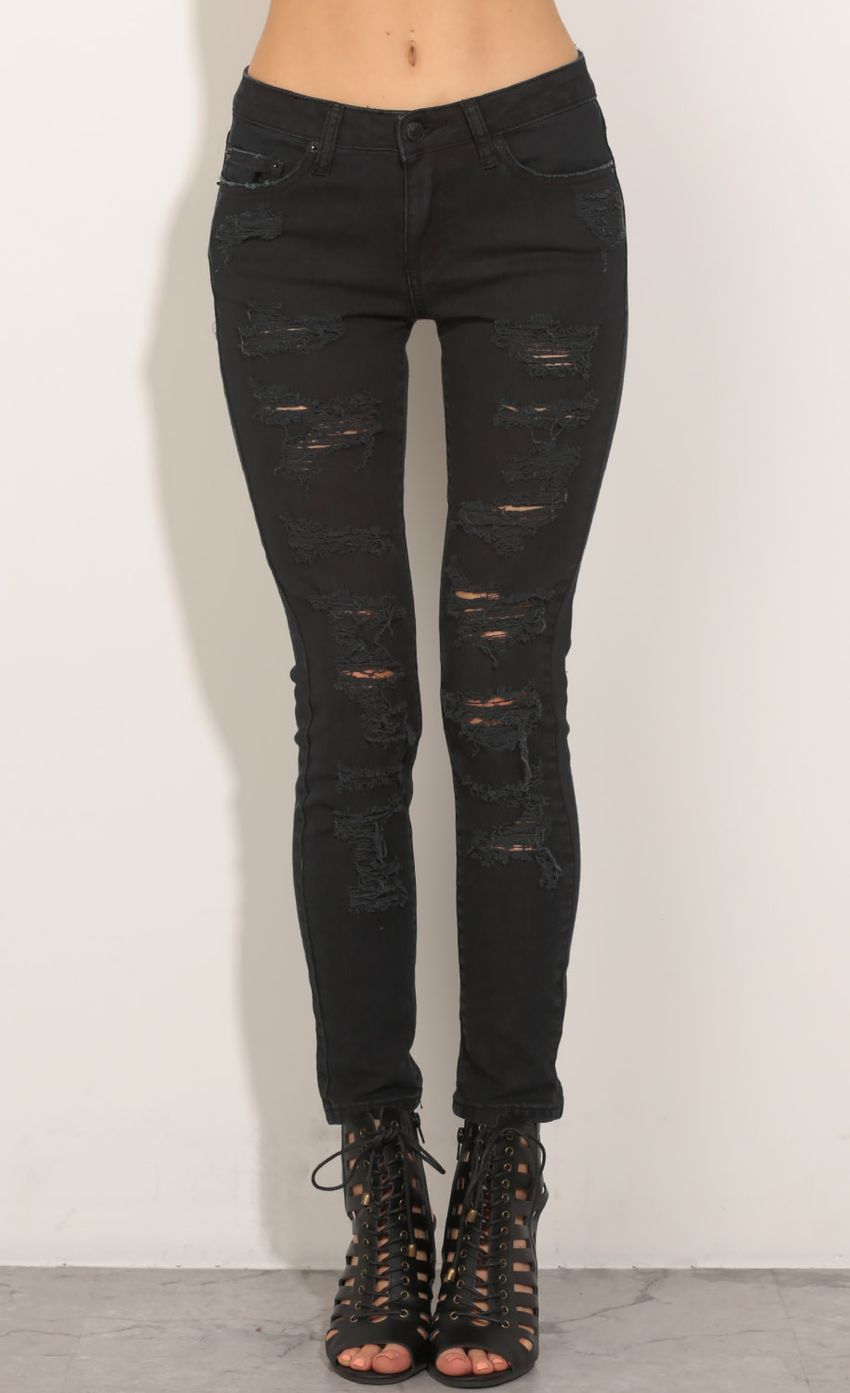 Picture Distressed Lowrise Jeans In Black. Source: https://media-img.lucyinthesky.com/data/May16_2/850xAUTO/0Y5A7447.JPG