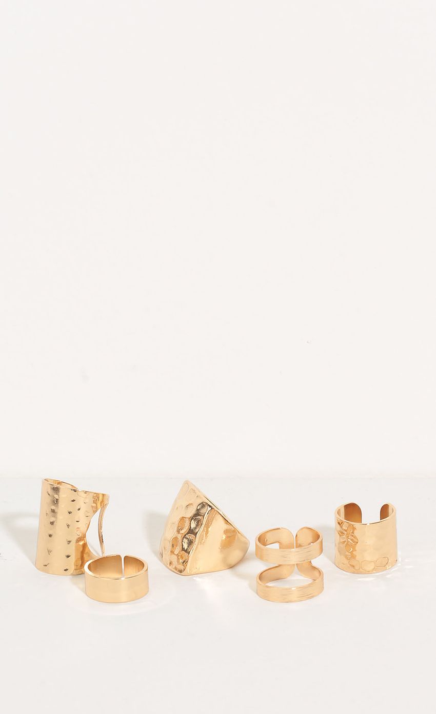 Picture Textured Multi-Finger Ring Set In Gold. Source: https://media-img.lucyinthesky.com/data/May16_2/850xAUTO/0Y5A8610.JPG