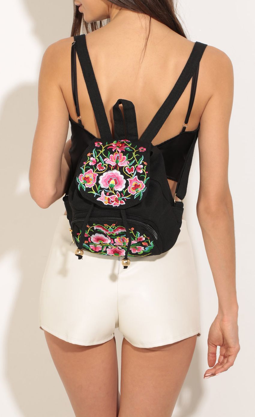 Picture Floral And Fringe Mini Backpack In Black. Source: https://media-img.lucyinthesky.com/data/May17_2/850xAUTO/0Y5A8200.JPG