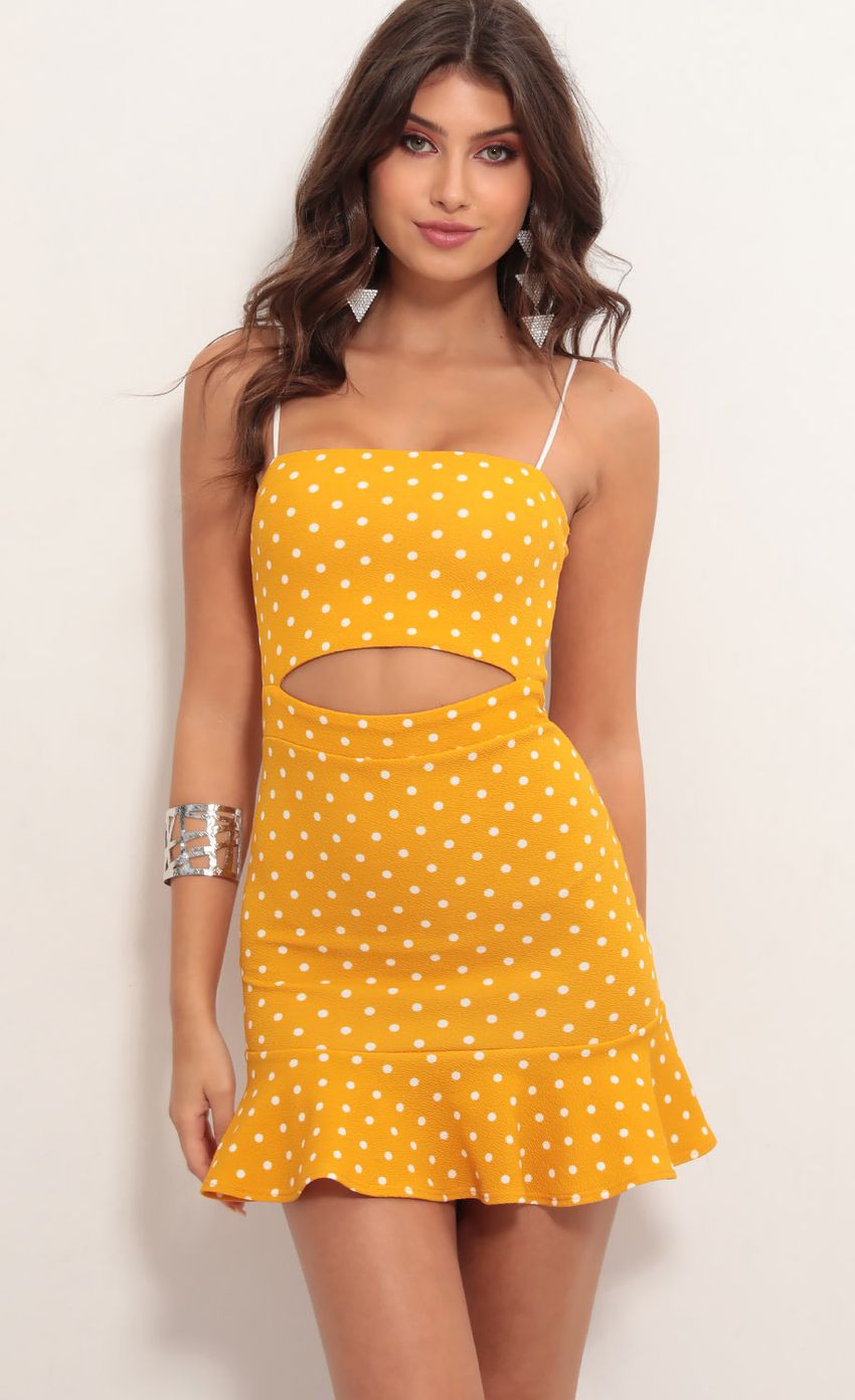 Picture Reilly Cutout Ruffle Dress in Yellow Polka Dot. Source: https://media-img.lucyinthesky.com/data/May19_1/850xAUTO/781A5978.JPG