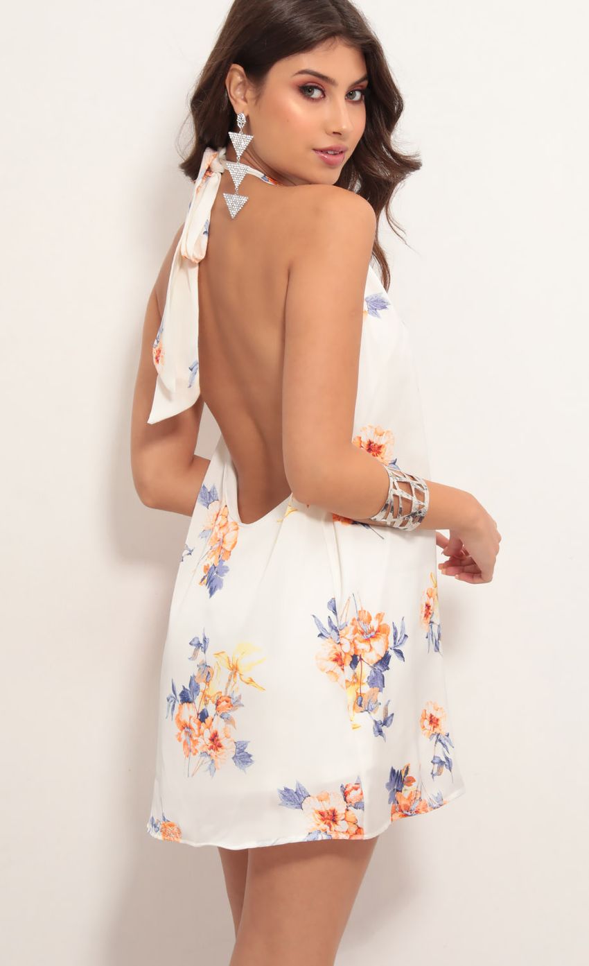 Picture Midnight Satin Halter Dress in White Floral. Source: https://media-img.lucyinthesky.com/data/May19_1/850xAUTO/781A6137.JPG