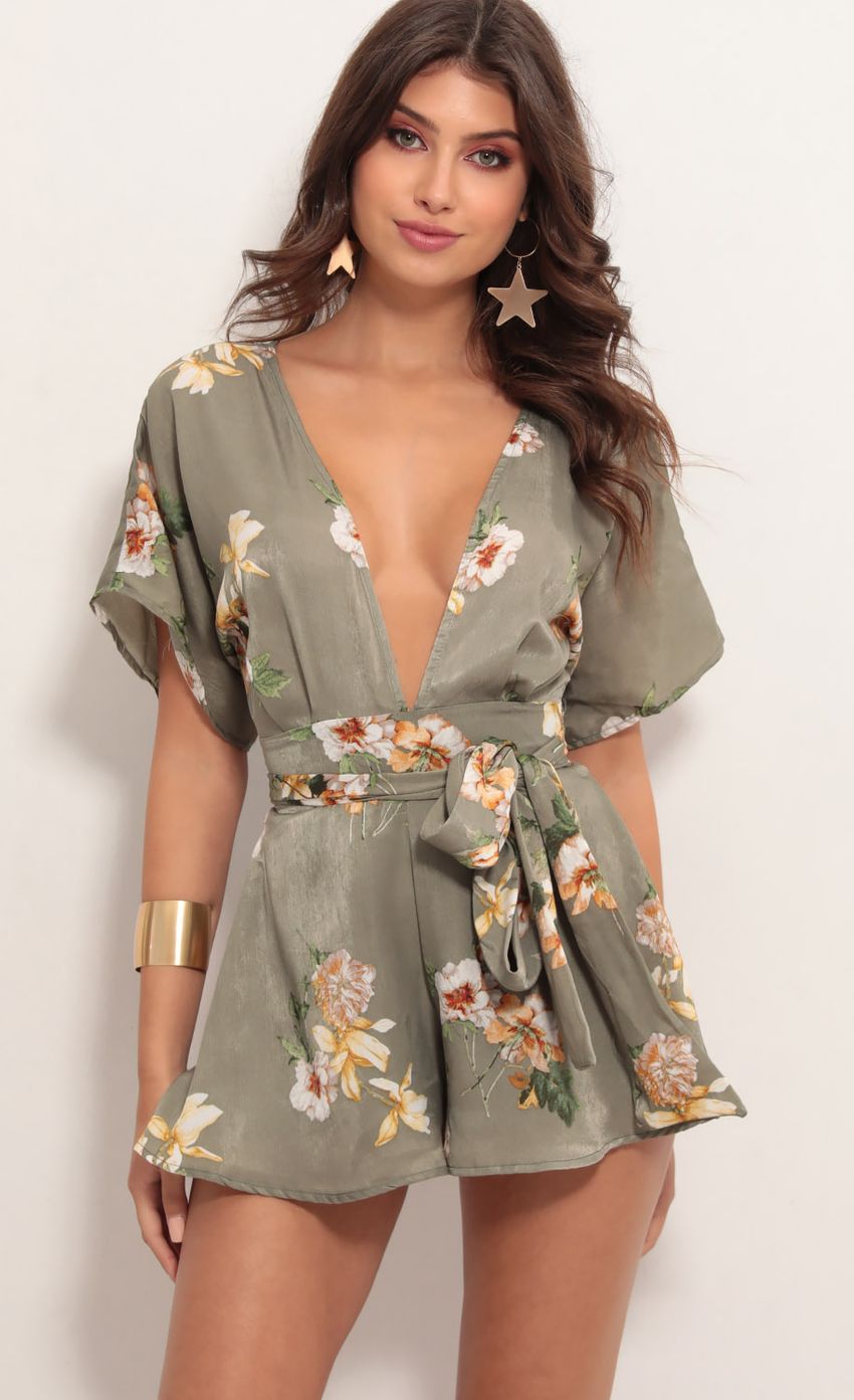 Picture Feeling The Night Romper in Sage Floral Satin. Source: https://media-img.lucyinthesky.com/data/May19_1/850xAUTO/781A6808.JPG