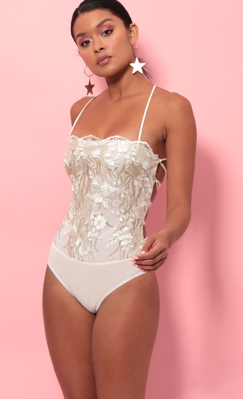 Picture Lara Lace Edge Bodysuit in Ivory Gold. Source: https://media-img.lucyinthesky.com/data/May19_2/850xAUTO/781A1466.JPG