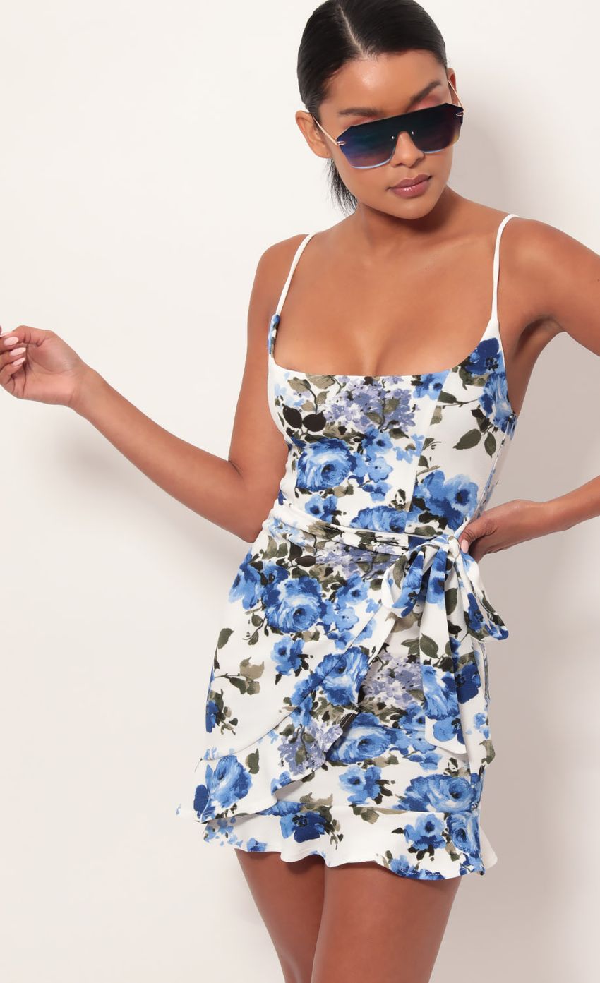 Picture Capri Ruffle Tie Dress in Blue Floral. Source: https://media-img.lucyinthesky.com/data/May19_2/850xAUTO/781A9215.JPG