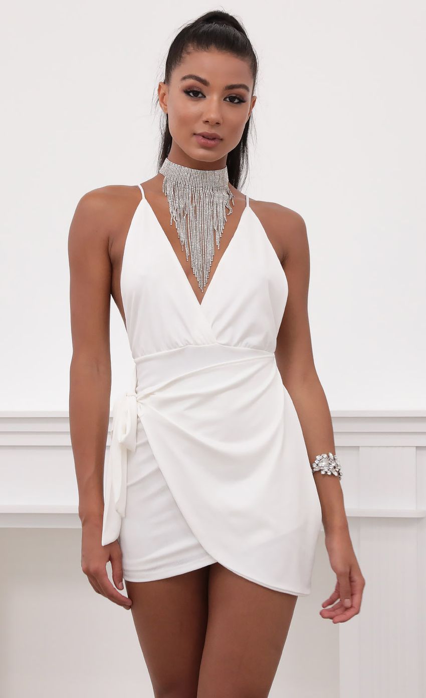 Picture Wrap Dress in White. Source: https://media-img.lucyinthesky.com/data/May20_2/850xAUTO/781A6598.JPG