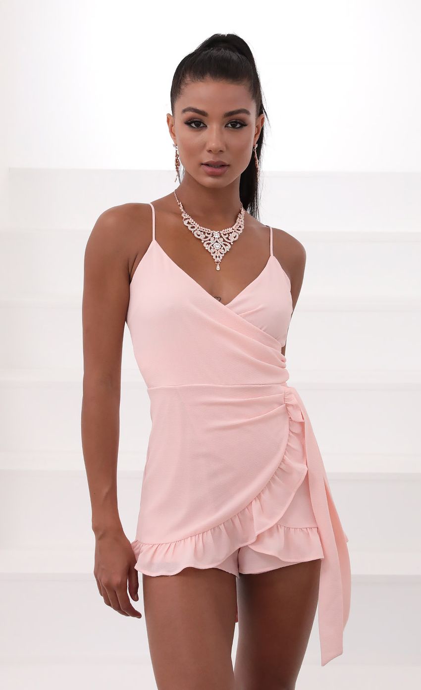 Picture Wrap Romper in Pink. Source: https://media-img.lucyinthesky.com/data/May20_2/850xAUTO/781A8191.JPG