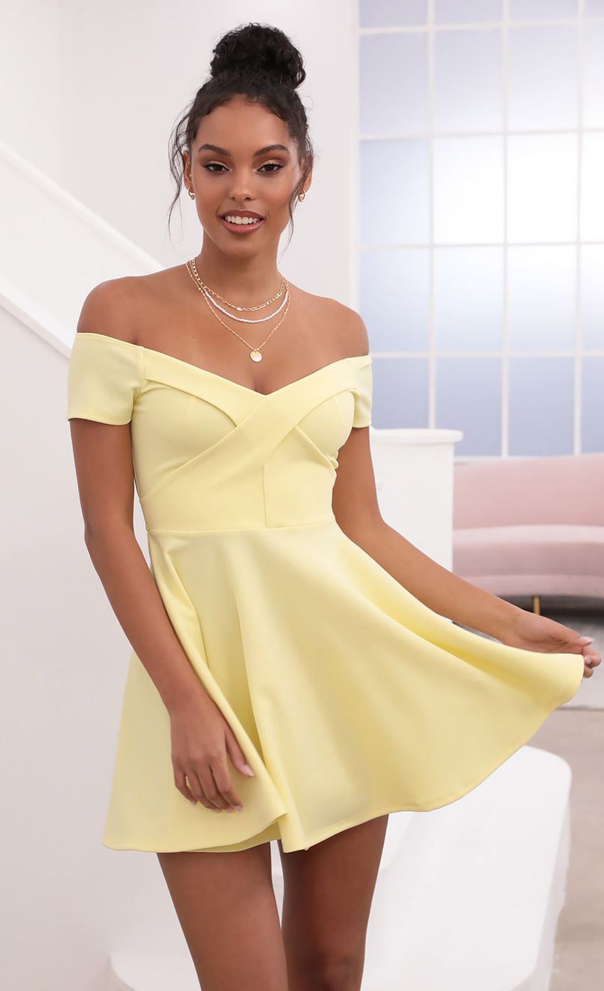 Picture Ambrose Pleated A-line Dress in Yellow. Source: https://media-img.lucyinthesky.com/data/May21_1/850xAUTO/1V9A1254.JPG