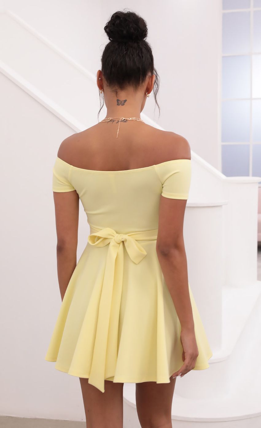 Picture Ambrose Pleated A-line Dress in Yellow. Source: https://media-img.lucyinthesky.com/data/May21_1/850xAUTO/1V9A1259.JPG