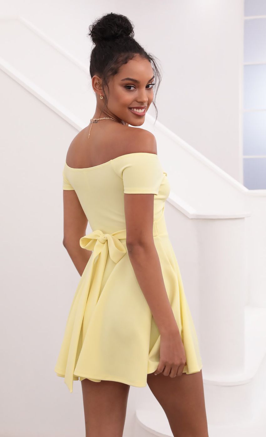 Picture Ambrose Pleated A-line Dress in Yellow. Source: https://media-img.lucyinthesky.com/data/May21_1/850xAUTO/1V9A1266.JPG
