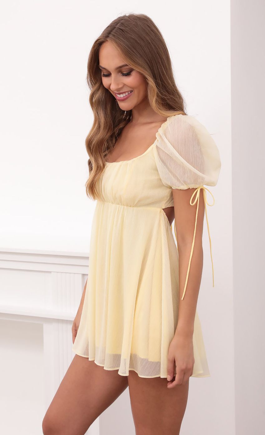 Picture Crinkle Chiffon Baby Doll Dress in Pastel Yellow. Source: https://media-img.lucyinthesky.com/data/May21_1/850xAUTO/1V9A1715.JPG