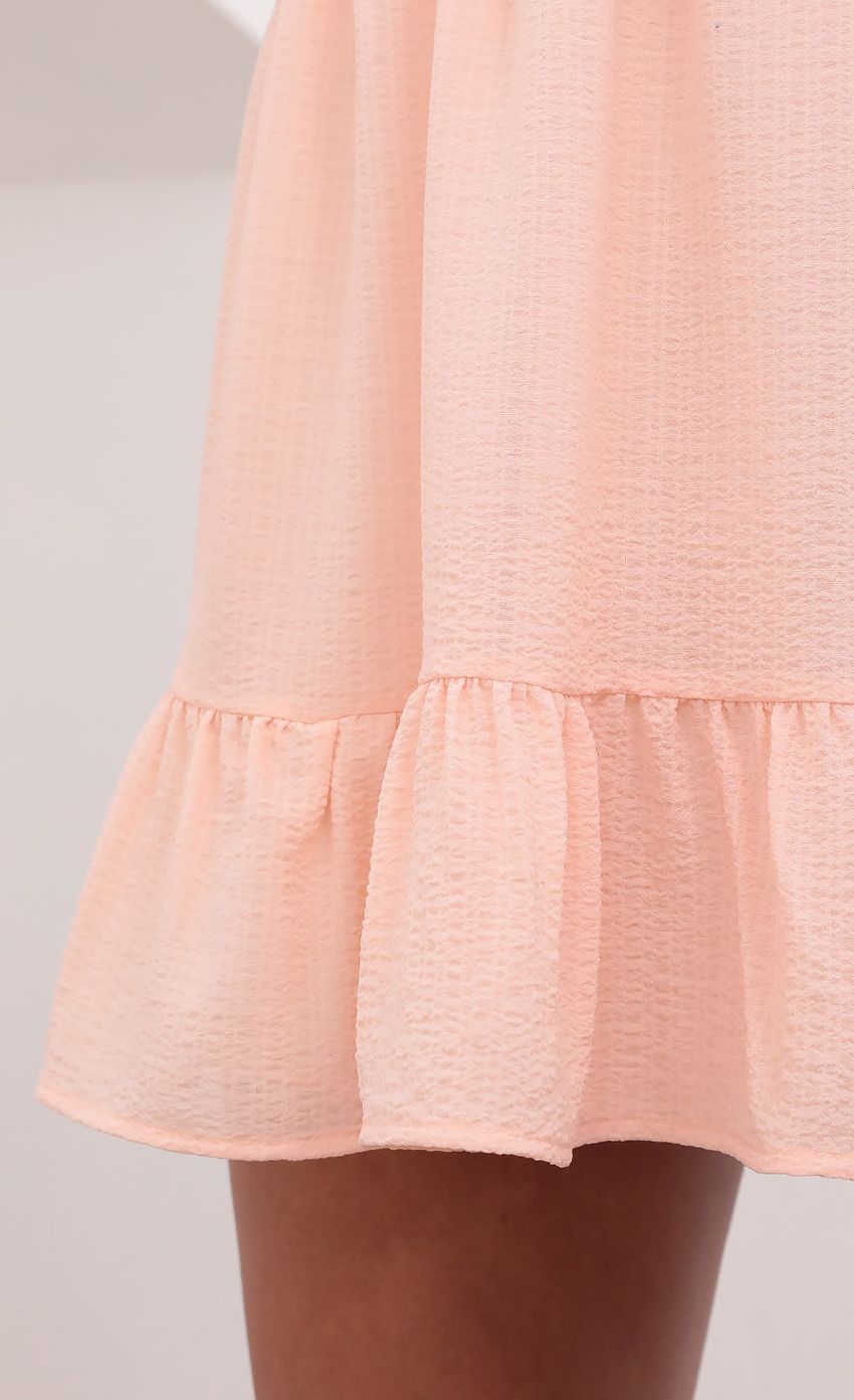 Picture V-Neck Ruffle Dress in Pastel Salmon. Source: https://media-img.lucyinthesky.com/data/May21_1/850xAUTO/1V9A2429.JPG