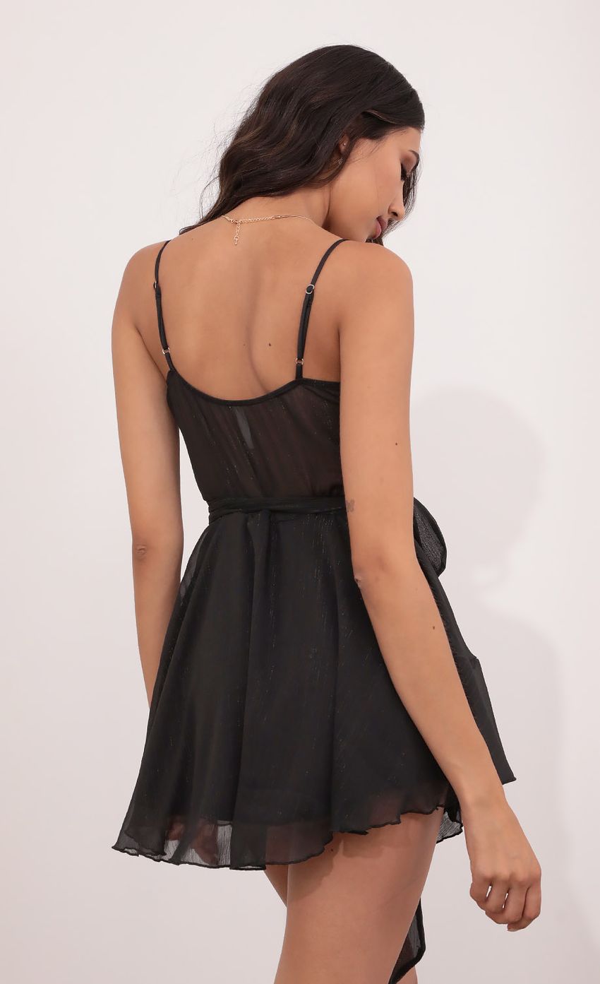 Picture Wrap Dress in Black Shimmer. Source: https://media-img.lucyinthesky.com/data/May21_1/850xAUTO/1V9A5536.JPG