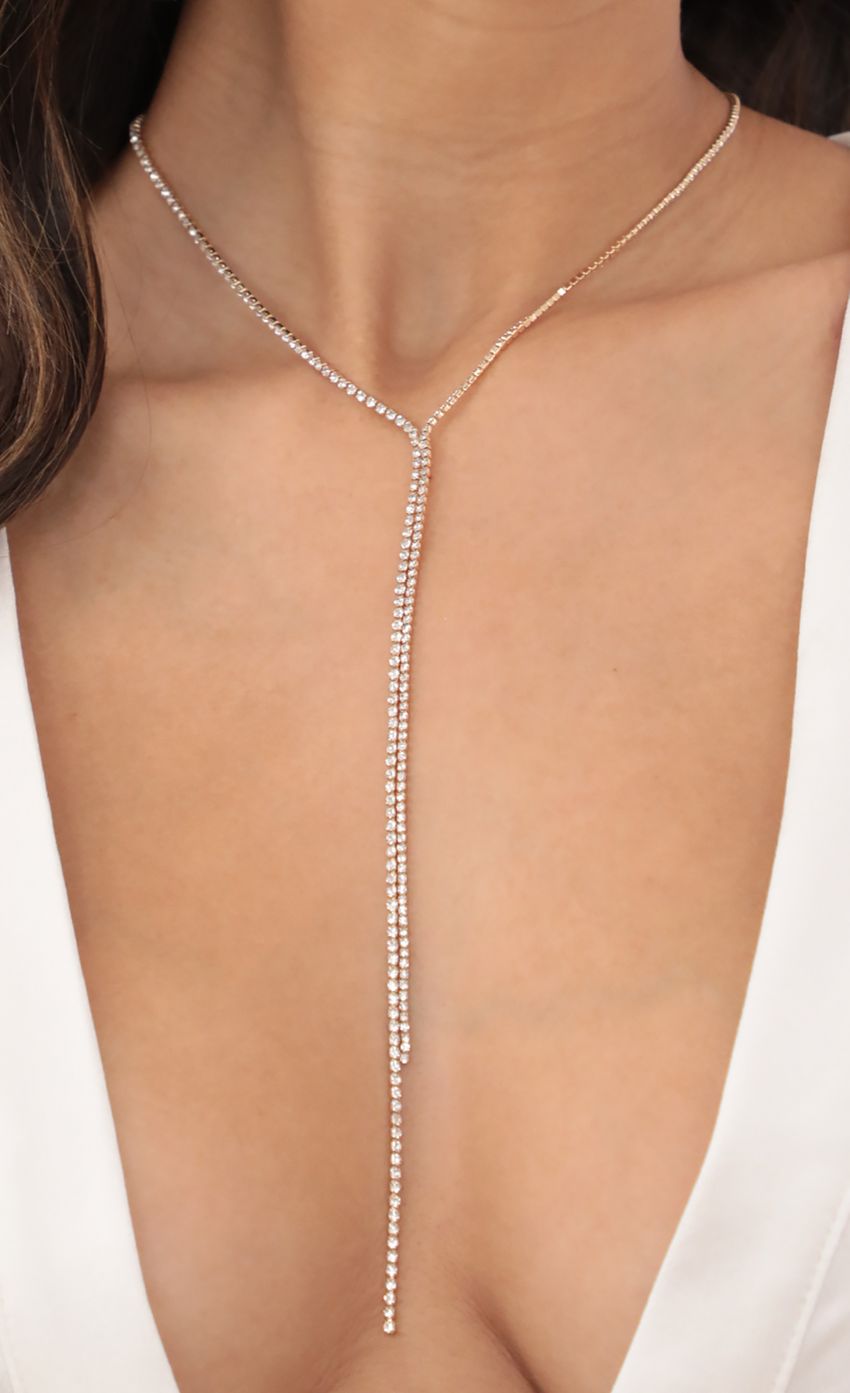 Picture Dainty Crystal Gold Lariat. Source: https://media-img.lucyinthesky.com/data/May21_1/850xAUTO/AT2A3493.JPG