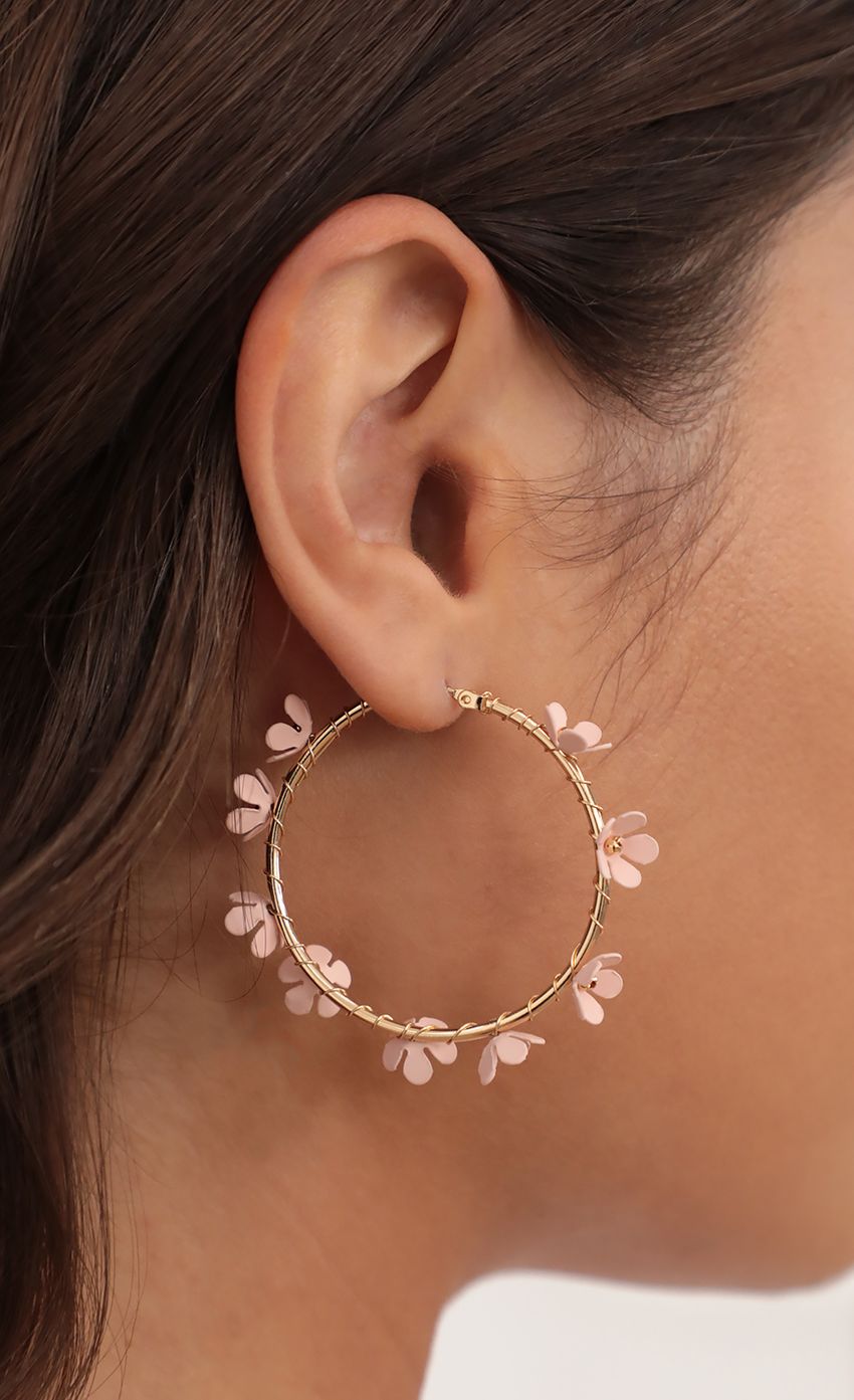 Picture Flower Embellished Gold Hoops. Source: https://media-img.lucyinthesky.com/data/May21_1/850xAUTO/AT2A3902.JPG