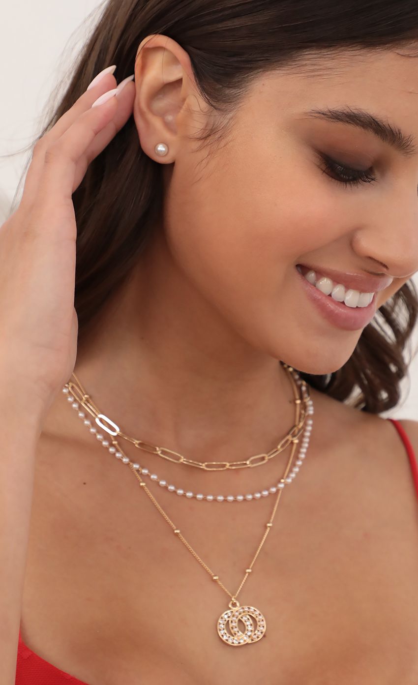 Picture Pearl Interlocking Ring Necklace and Earring Set. Source: https://media-img.lucyinthesky.com/data/May21_1/850xAUTO/AT2A4309.JPG