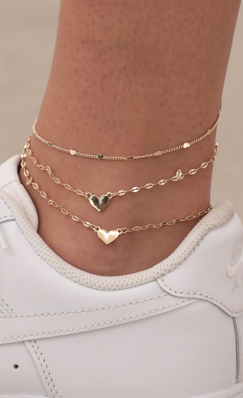 Picture Triple Heart Gold Anklet. Source: https://media-img.lucyinthesky.com/data/May21_1/850xAUTO/AT2A4547.JPG