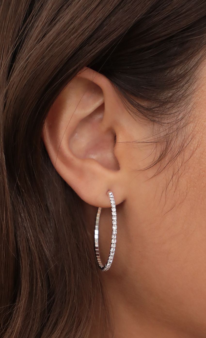 Picture Crystal Pave Wire Hoop in Silver. Source: https://media-img.lucyinthesky.com/data/May21_1/850xAUTO/AT2A5186.JPG