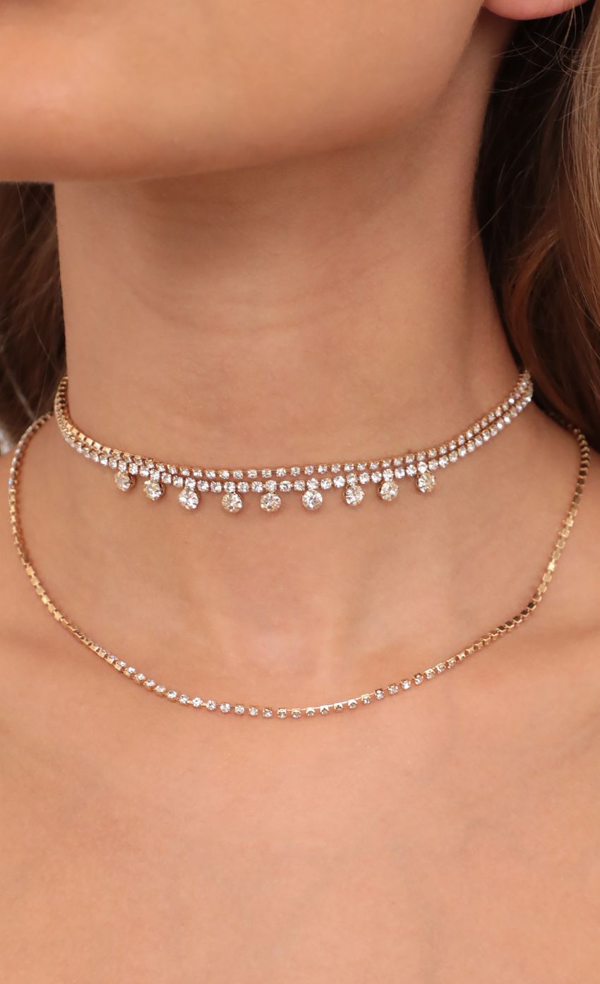Picture Crystal Embellished Choker Set in Gold. Source: https://media-img.lucyinthesky.com/data/May21_1/850xAUTO/AT2A6431.JPG