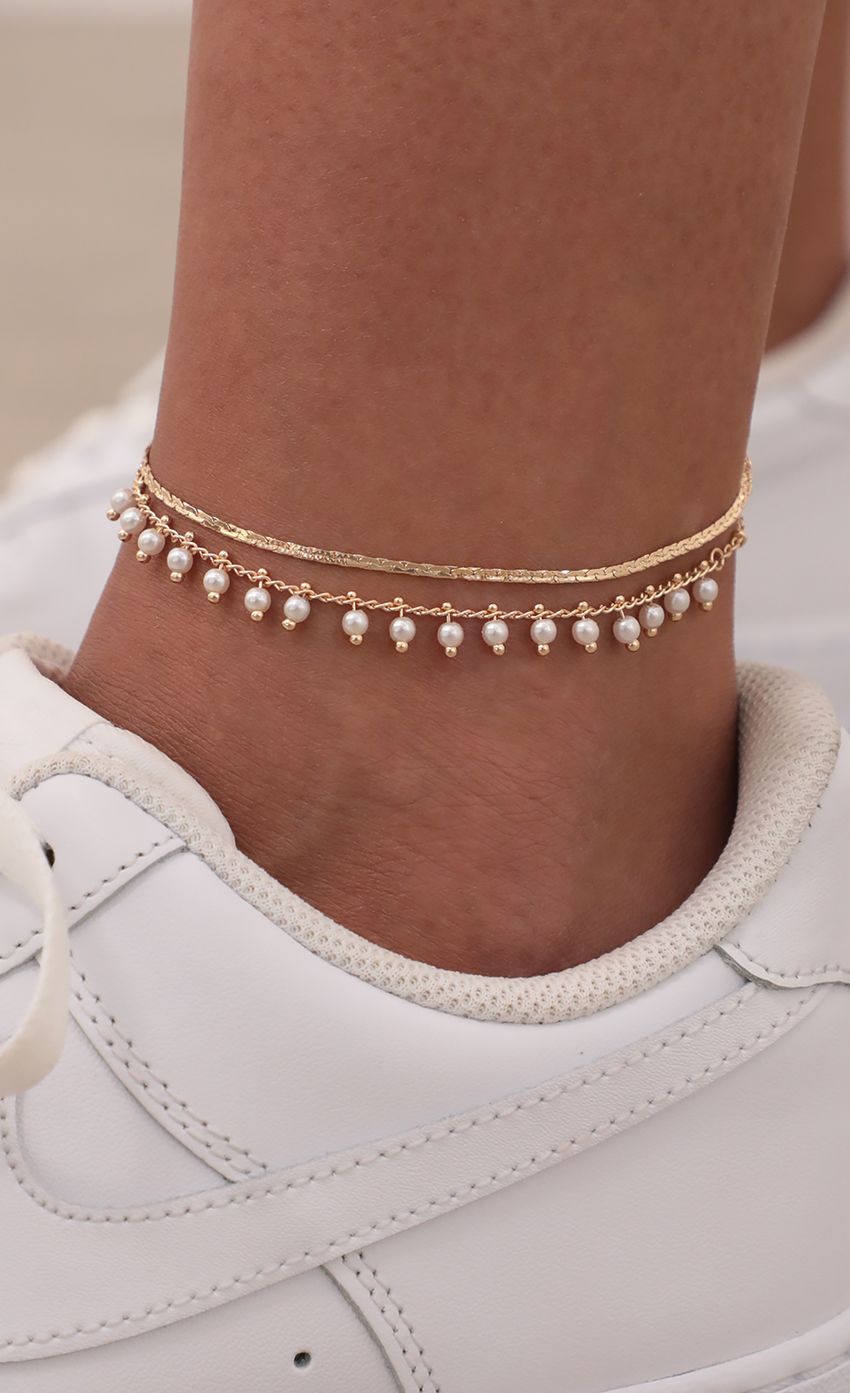 Picture Pom-Pom Pearl Anklet in Gold. Source: https://media-img.lucyinthesky.com/data/May21_1/850xAUTO/AT2A7466.JPG