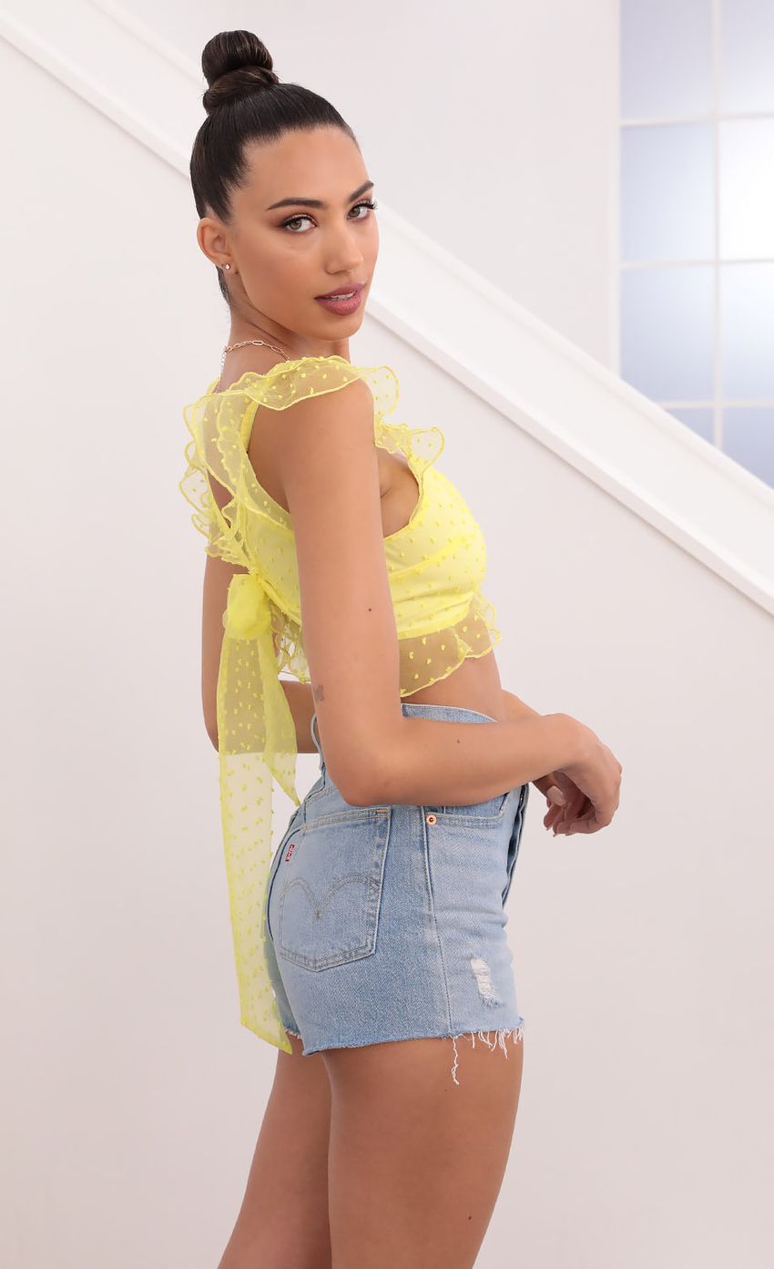 Picture Dotted Chiffon Top in Yellow. Source: https://media-img.lucyinthesky.com/data/May21_2/850xAUTO/1V9A0942.JPG