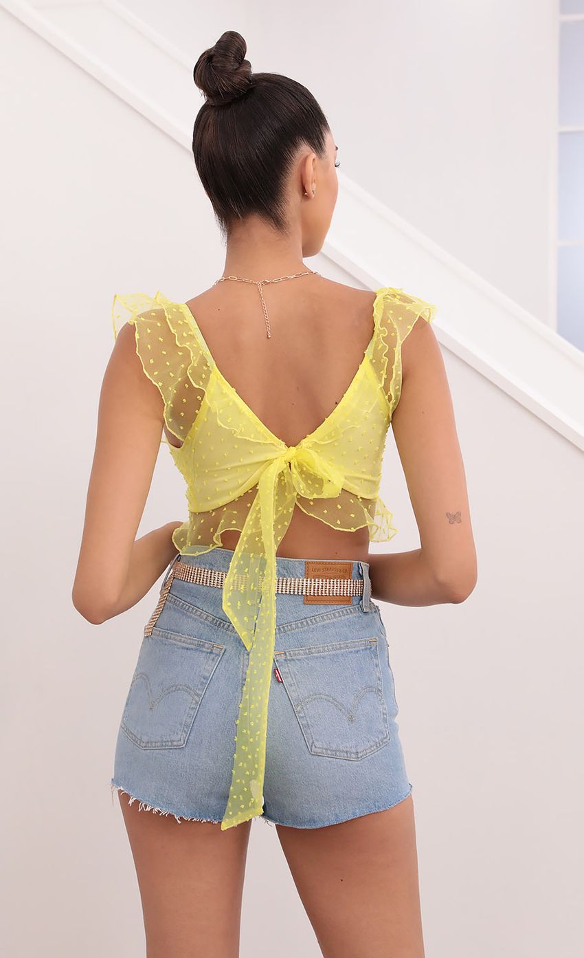 Picture Dotted Chiffon Top in Yellow. Source: https://media-img.lucyinthesky.com/data/May21_2/850xAUTO/1V9A0959.JPG