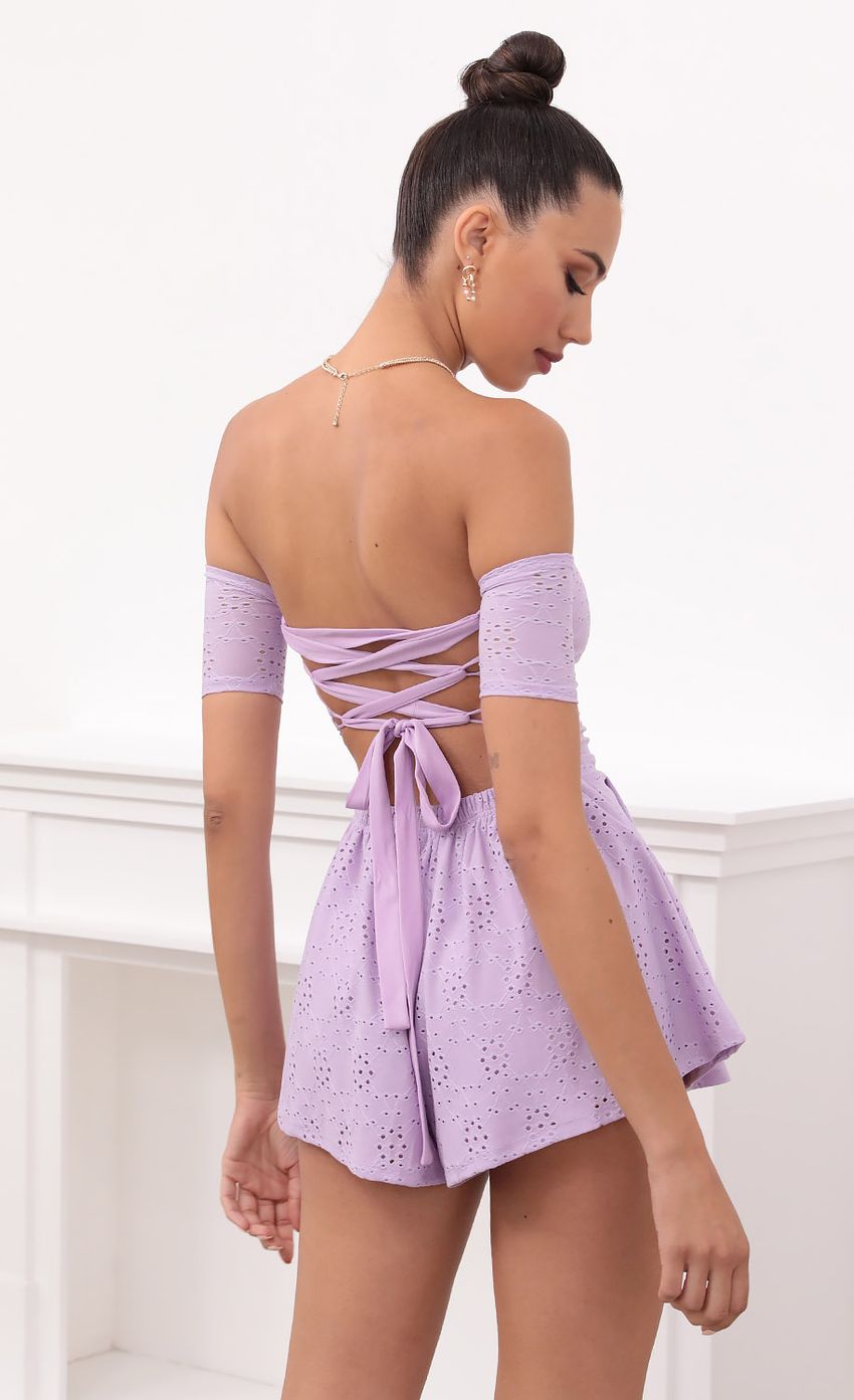 Picture Lavender Eyelet Lace-Up Romper. Source: https://media-img.lucyinthesky.com/data/May21_2/850xAUTO/1V9A2691.JPG
