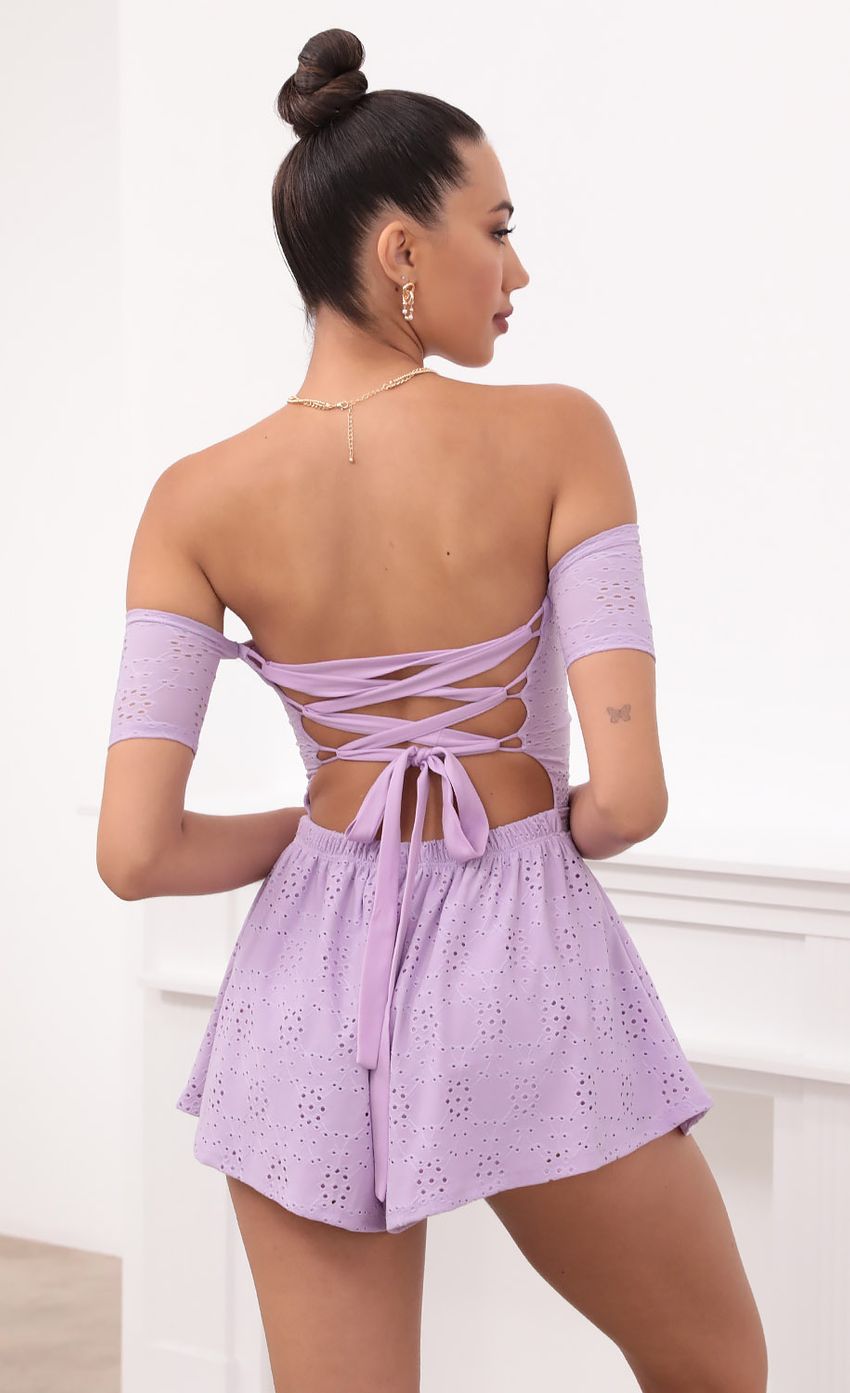 Picture Lavender Eyelet Lace-Up Romper. Source: https://media-img.lucyinthesky.com/data/May21_2/850xAUTO/1V9A2711.JPG