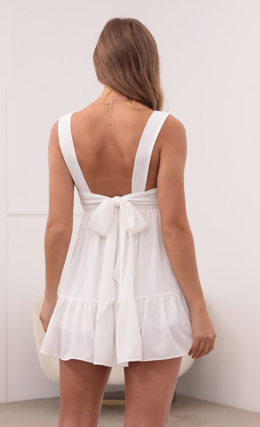 Picture Square Neckline Dress in White Pinstripes. Source: https://media-img.lucyinthesky.com/data/May21_2/850xAUTO/1V9A3013.JPG