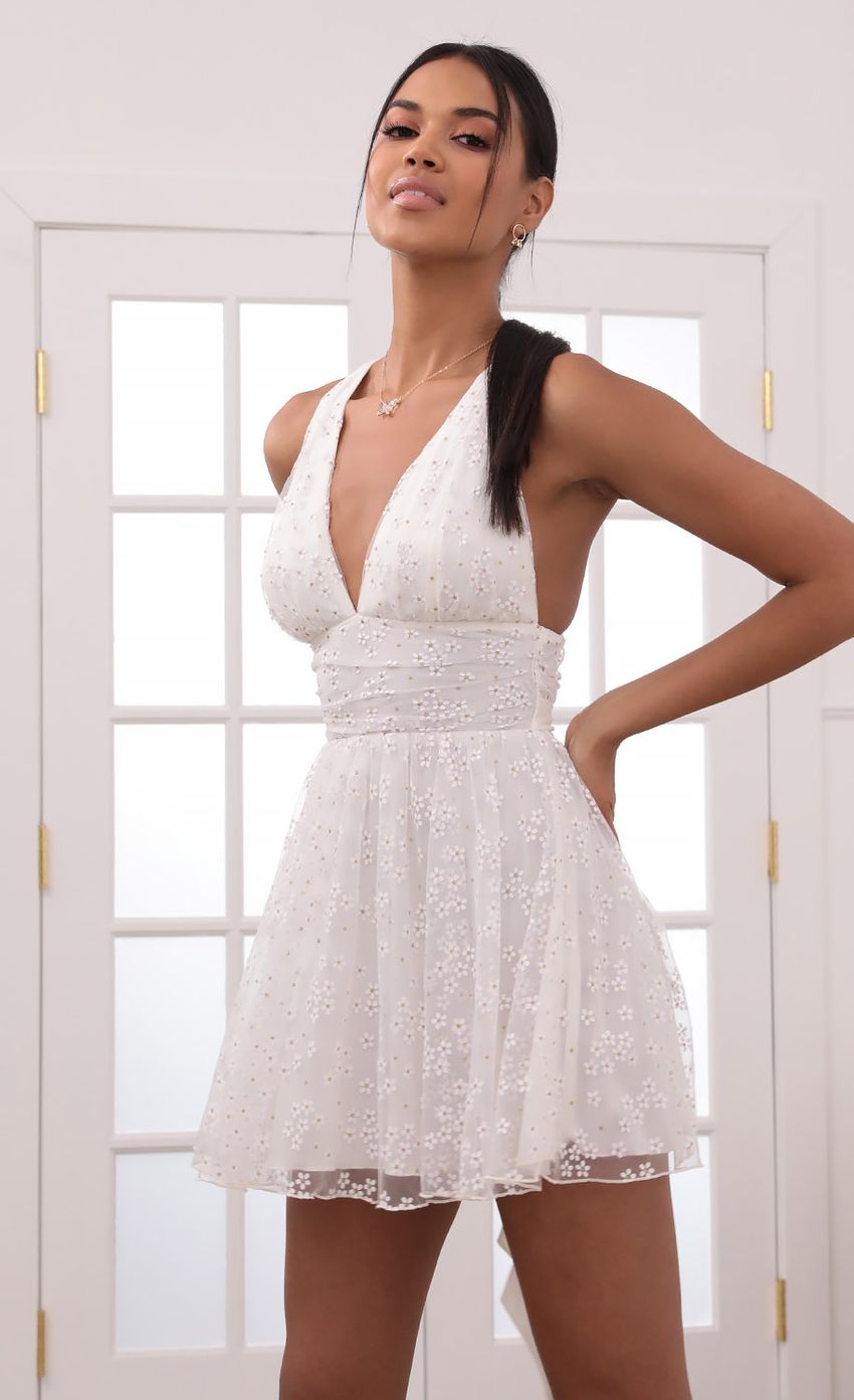 Picture Plunge A-Line Dress in White Daisies. Source: https://media-img.lucyinthesky.com/data/May21_2/850xAUTO/1V9A3021.JPG