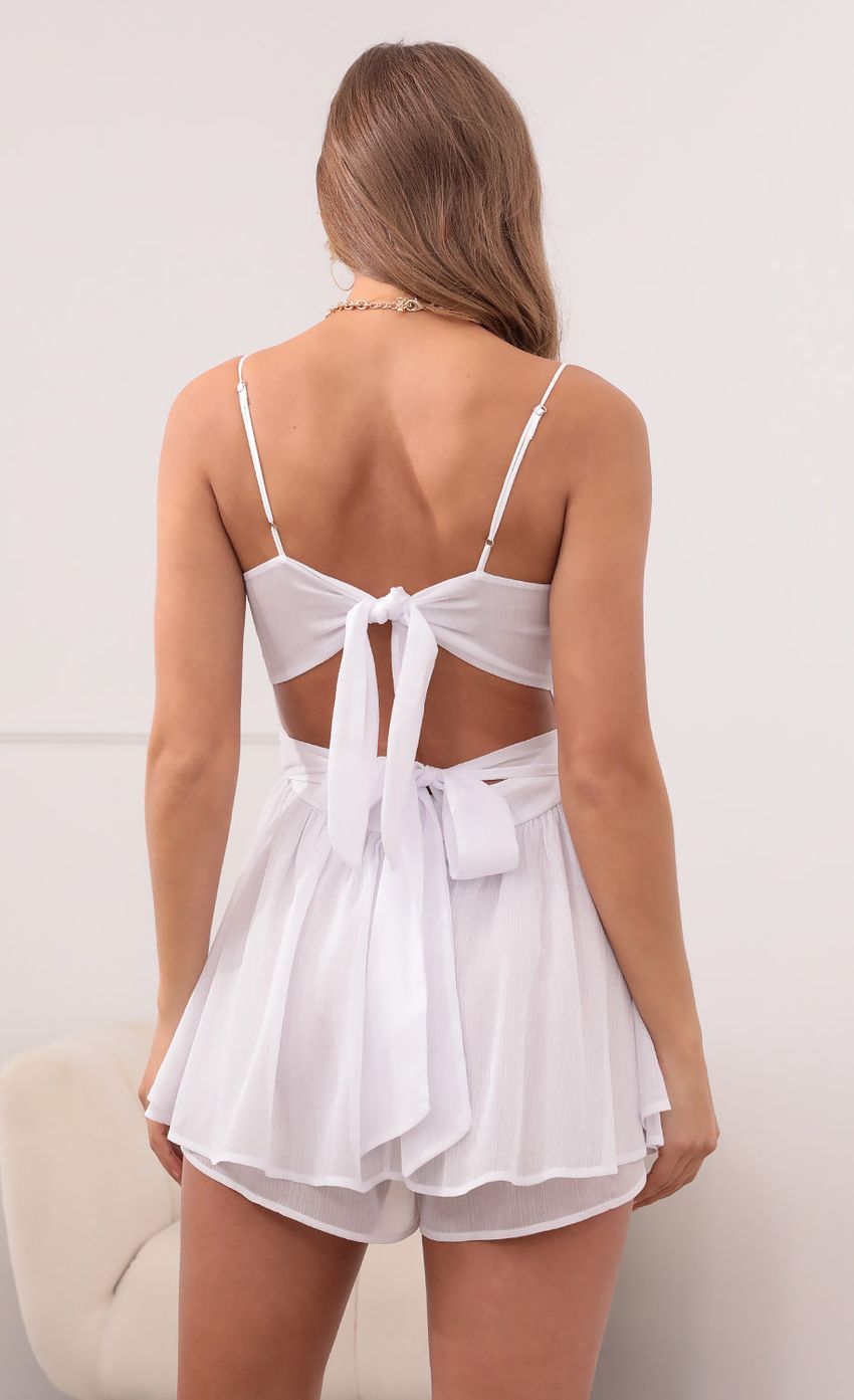 Picture Double Ruffle Romper in White Shimmer. Source: https://media-img.lucyinthesky.com/data/May21_2/850xAUTO/1V9A3639.JPG
