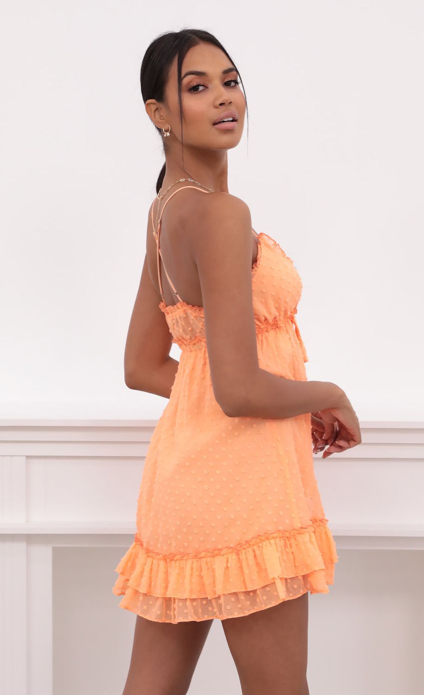 Picture Tangerine Dress in Dotted Chiffon. Source: https://media-img.lucyinthesky.com/data/May21_2/850xAUTO/1V9A3738.JPG
