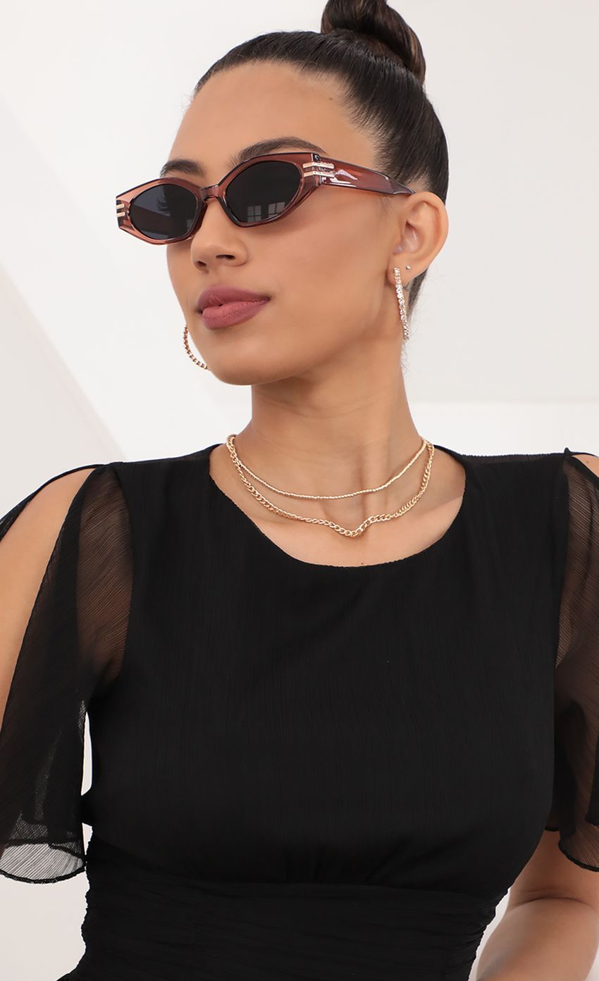 Picture Doheny Sunglasses in Clear Rust With Gold Accents. Source: https://media-img.lucyinthesky.com/data/May21_2/850xAUTO/AT2A0475.JPG