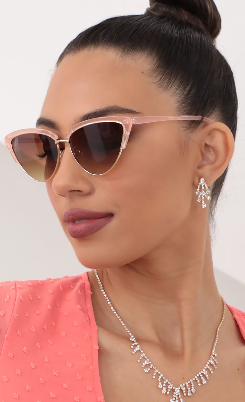 Picture Hollywood Cat-Eye Sunglasses in Clear Pink. Source: https://media-img.lucyinthesky.com/data/May21_2/850xAUTO/AT2A1308_2.JPG